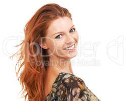 Dazzling you with her charm and poise..not to mention that smile. Vivacious red-head smiling back over her shoulder at you, isolated on white - copyspace.