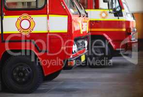 Ready for action. Cropped shot of parked fire engines.