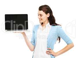 Technology makes life so much easier. Pretty young woman holding up a laptop with the screen facing you against a white background.
