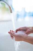 Wash away those germs. Shot of hands being washed at a tap.