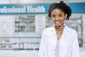 We offer affordable health care products catered just for you. Portrait of an attractive young pharmacist smiling and posing in a pharmacy.