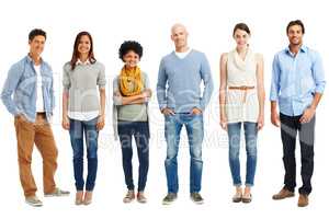 Stylish and casual line-up. Casually dressed group of young adults standing against a white background.