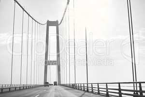 Storebaelt (or The Great Belt) suspension bridge in Denmark. Cars driving along The Great Belt suspension bridge in Denmark.