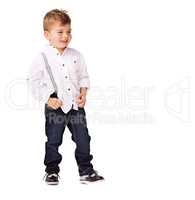 Dressed to impress. A cute little boy posing on a white background.