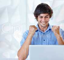 I got that promotion. Shot of an ecstatic young businessman sitting in front of her laptop.