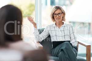 Restoring mental health starts with talking. Shot of a mature psychologist having a therapeutic session with her patient.