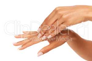 Loving the soft feeling of her skin. A young woman feeling her silky, smooth skin while isolated on a white background.