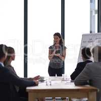 There are no shortcuts to success. Cropped shot of a businesswoman giving a presentation to her colleagues in a boardroom.
