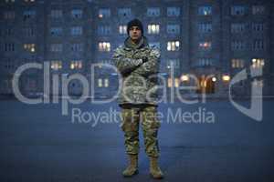 Today a cadet, tomorrow a colonel. Shot of a young soldier standing outside on a cold day at military school.