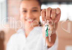 Im ready to unlock a new chapter. Shot of a woman holding up the key to her new home.