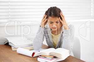 I just cant get this right. Shot of an attractive young college student battling with her studies.