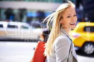 Loving city life. A portrait of a beautiful young woman in the city.