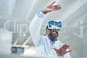 Shaping a whole new world through science. Shot of a mature scientist using a virtual reality headset while working in a lab.