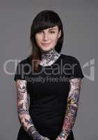 Let your beauty rise to the surface. A cropped studio portrait of a beautiful tattooed young woman.