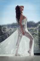 Transparent beauty. Full length shot of a young woman posing in a sheer dress outside.