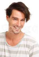 Let natural enthusiasm sell your message. Sweet smiling young man with messed up hair, isolated on white - copyspace.
