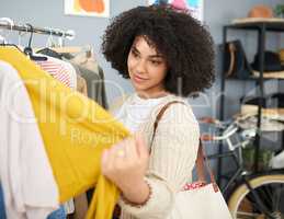 I dont have anything in this color. Cropped shot of a young woman shopping for clothes in a store.