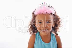 Shes just a little princess. Studio portrait of an adorable little girl in a tiara isolated on white.