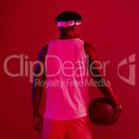 If I love something, I give it my all. Red filtered shot of a young sportsman posing with a basketball in the studio.