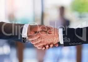 The beginning of a business empire. Cropped shot of two businessmen shaking hands.