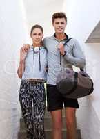 Staying fit and healthy together. Shot of a sporty young couple on their way to the gym together.