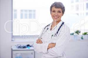 Her medical practice is well organised. Shot of a female doctor standing in a room with her arms crossed.
