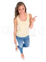 Shes got a casual confidence about her. High angle shot of a beautiful young woman standing against a white background.