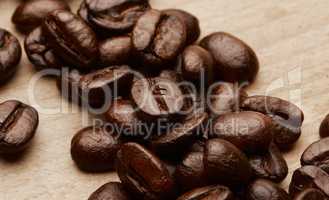 Theyre called energy beans. Still life shot of coffee beans on a wooden countertop.