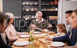 They always get together on special occasions. Cropped shot of a family sitting down to dinner.