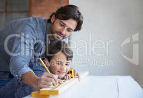 Let me show you what to do.... A father and son doing woodwork together.