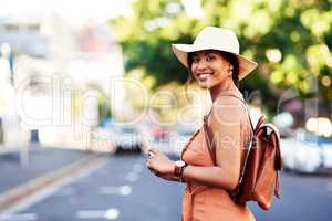 City adventures are always the best. Portrait of an attractive young woman taking pictures with a camera while sightseeing in a foreign city.