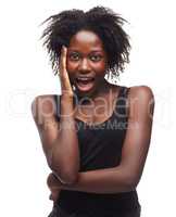 Simplicity is everything. Portrait of a beautiful young woman expressing positivity on a white background.