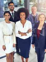 Teamwork enables smoother movement towards targets. Portrait of a team of corporates standing together in an office.