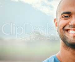 When it comes to competing, I always show my strong side. Closeup portrait of a handsome young male athlete standing outside on a sports field.