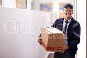 For reliable and reputable delivery Im your guy. Portrait of a confident young courier making a home delivery.
