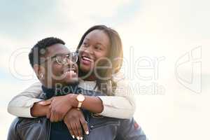 What a lovely day this turned out to be. Shot of an affectionate young couple bonding together outdoors.