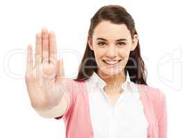 Its time to stop and take a moment. Young woman showing a stop hand gesture against a white background.