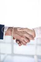 Pleasure doing business with you. Shot of two unrecognizable businesspeople shaking hands in agreement.