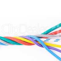 Colorful cords. Studio shot ropes knotted together isolated on white.