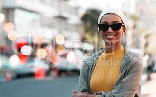 Theres nothing like touring the city. Cropped shot of an attractive young woman wearing a hijab and sunglasses while touring the city.