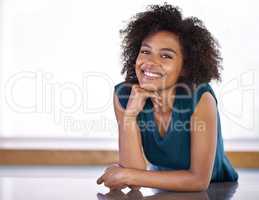 The magic Im going to work in this kitchen.... Portrait of an attractive young woman standing in her kitchen.