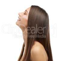 Feeling free. A beautiful young woman with luxurious hair isolated on a white background.