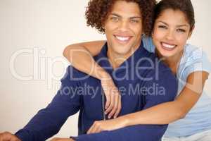 Were embarking on a bright future. Gorgeous mixed race couple smiling affectionately for the camera.