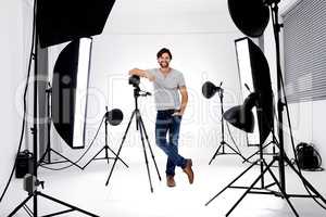 Ready to take your portrait. A professional photographer with his equipment.