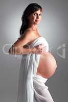 Expecting her arrival soon. A pregnant woman holding her tummy.