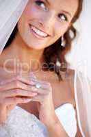 The promise of forever. Closeup of a young bride wearing her wedding ring.