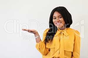 Id highly recommend you take a look sometime. Studio portrait of a cheerful young woman standing with her hand raised against a white background.