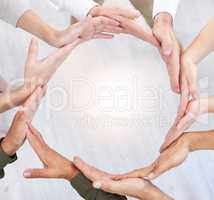 When you think and act like a team. Shot of a group of business people with their hands together in a circle.