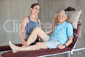 Hes on the mend. Shot of a a physical therapist working with a senior man.