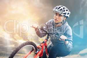 Bicycles may change, but cycling is timeless. Shot of a female mountain biker out for an early morning ride.